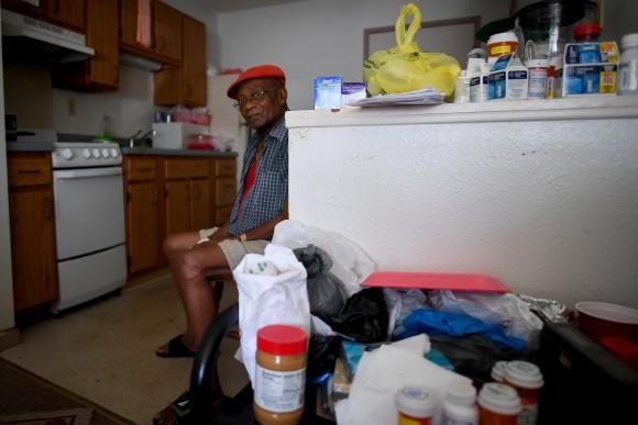 Two days after Hurricane Irma, William James, 83, sits without power, food or water, in his room at Cypress Run, an assisted living facility, in Immokalee, Florida, U.S., September 12, 2017. (Reuters/Bryan Woolston)