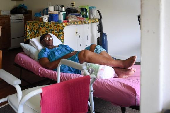 Two days after Hurricane Irma, Mary Mitchell, 82, lays on a hospital bed in her room, without power, food, or water at Cypress Run, an assisted living facility, in Immokalee, Florida, September 12, 2017. (REUTERS/Bryan Woolston)