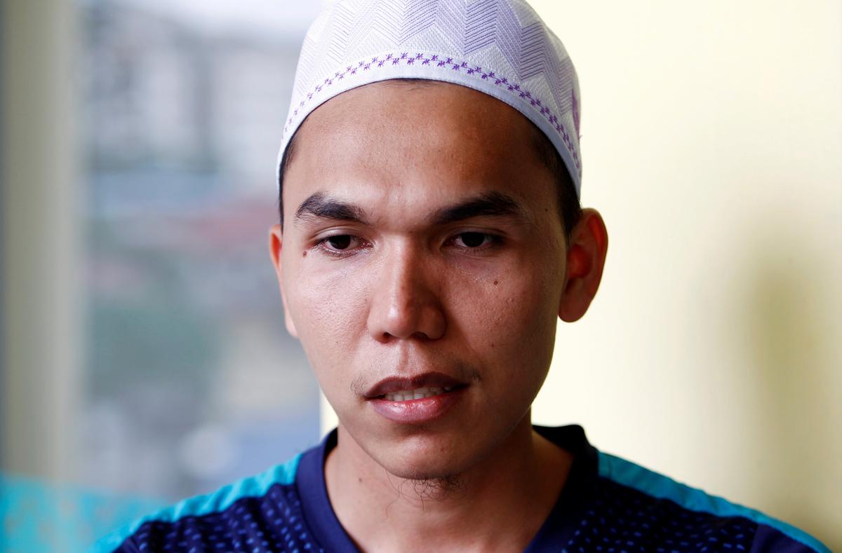 Mohd Arif Mawardi, one of the survivors of the fire at religious school Darul Quran Ittifaqiyah, speaks to journalists in Kuala Lumpur, Malaysia, on Sept. 14, 2017. (REUTERS/Lai Seng Sin)