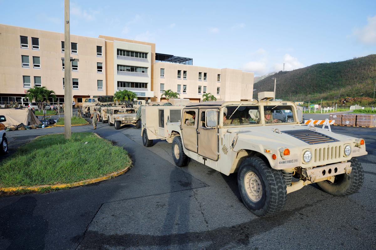 Soldiers from the 602nd Area Support Medical Company evacuate their unit from Schneider Regional Medical Center in advance of Hurricane Maria, in Charlotte Amalie, St. Thomas, U.S. Virgin Islands on Sept. 17, 2017. (REUTERS/Jonathan Drake)
