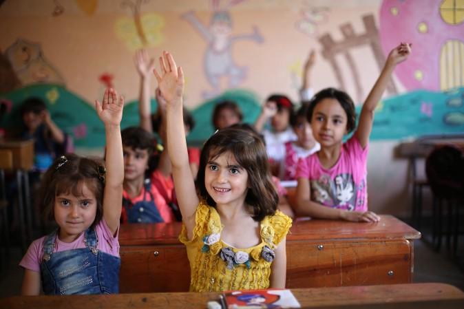 Syrian students in a school in the rebel-held Eastern Ghouta town of Douma on Sept. 18, 2017<br/>Syria's six-year conflict has ravaged its infrastructure and caused losses to its economy of $226 billion, according to estimates published by the World Bank. (AMER ALMOHIBANY/AFP/Getty Images)
