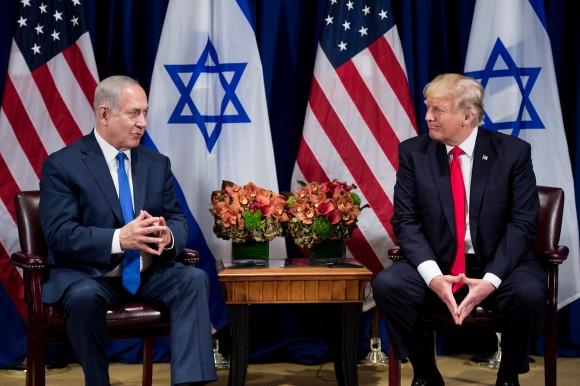 President Donald Trump listens while Israel's Prime Minister Benjamin Netanyahu makes a statement for the press before a meeting at the Palace Hotel during the 72nd session of the United Nations General Assembly in New York on Sept. 18, 2017. (BRENDAN SMIALOWSKI/AFP/Getty Images)