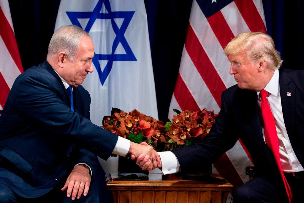 Israel's Prime Minister Benjamin Netanyahu (L) and US President Donald Trump shake hands before a meeting at the Palace Hotel during the 72nd session of the United Nations General Assembly in New York on Sept. 18, 2017. (BRENDAN SMIALOWSKI/AFP/Getty Images)
