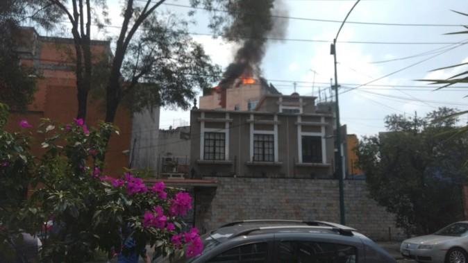 A building is seen on fire following an earthquake, in the district of colonia Roma, Mexico city, Mexico on Sept. 19, 2017 in this still image obtained via social media. (MIGUEL ANGEL QUISBERTH CORDERO/ via REUTERS)