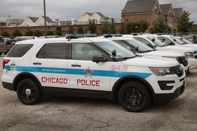 Ford Explorer based Police Interceptors sit in a police station parking lot in Chicago on Aug. 4, 2017. (Scott Olson/Getty Images)