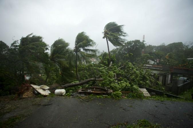 A picture taken on Sept. 19, 2017, shows the powerful winds and rains of Hurricane Maria battering the city of Petit-Bourg on the French overseas Caribbean island of Guadeloupe. Hurricane Maria strengthened into a "potentially catastrophic" Category 5 storm as it barrelled into eastern Caribbean islands still reeling from Irma, forcing residents to evacuate in powerful winds and lashing rain. (Cedrik-Ishma Calvados/AFP/Getty Images)