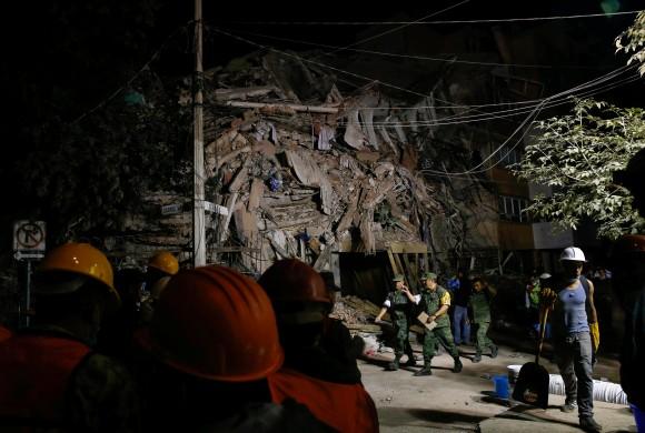 Soldiers and rescuers work at the site of a collapsed building after an earthquake in Mexico City on Sept. 20, 2017. (Henry Romero/Reuters)