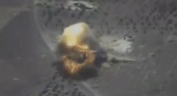 A still image taken from video footage and released by Russia's Defense Ministry on Sept. 22, 2017, shows a missile hitting a building, which the Defense Ministry said was a Jabhat al-Nusra target in Syria. (Russian Defense Ministry/Handout via Reuters TV)