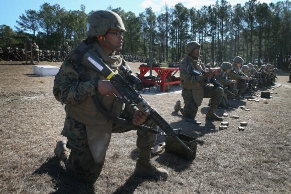 Female and male Marines line up on a firing line during a combat marksmanship course at Marine Combat Training (MCT) on February 20, 2013, at Camp Lejeune, North Carolina. (Scott Olson/Getty Images)