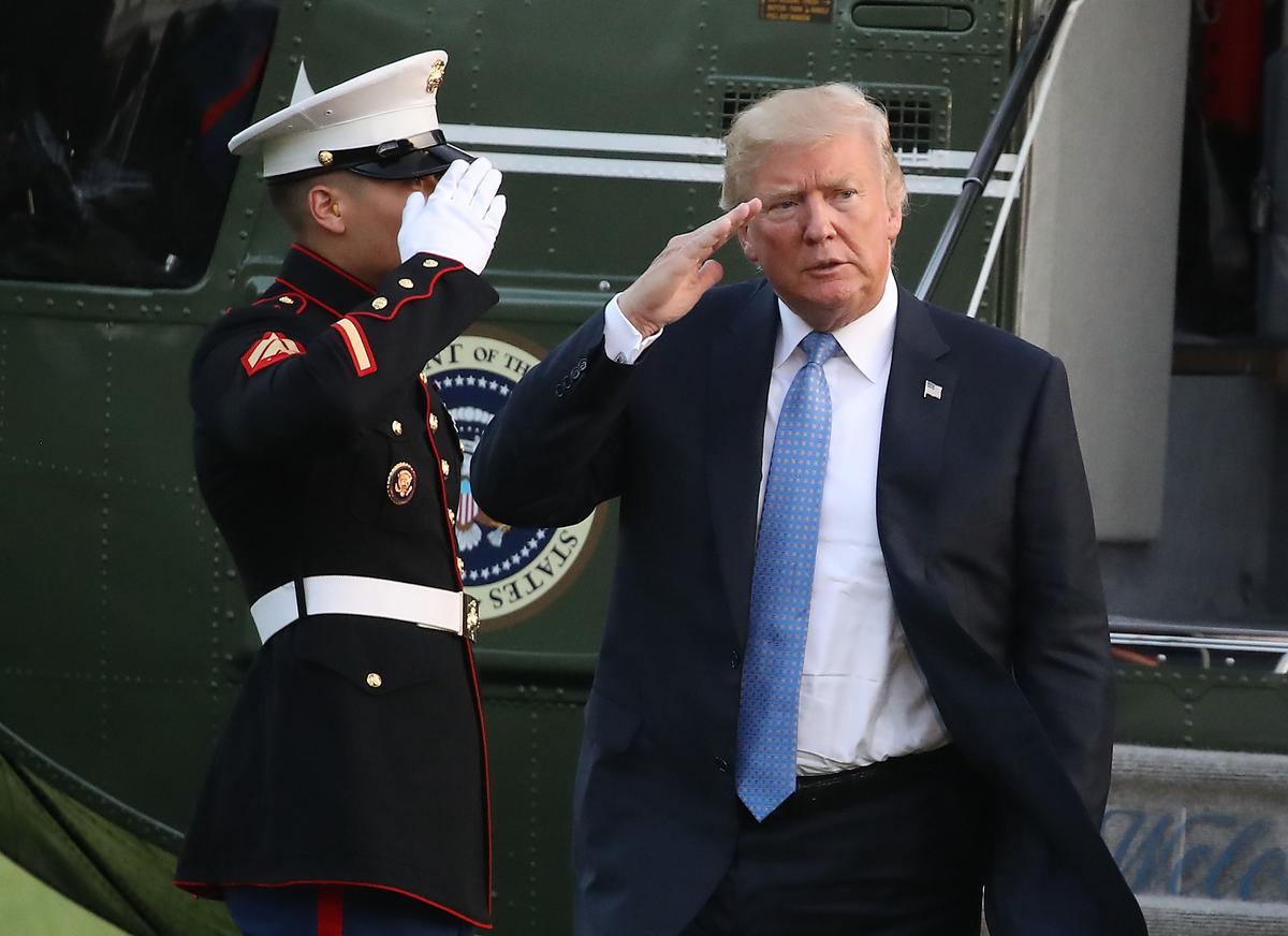 President Donald Trump salutes a Marine after arriving at the White House in Washington on Sept. 27, 2017. (Mark Wilson/Getty Images)