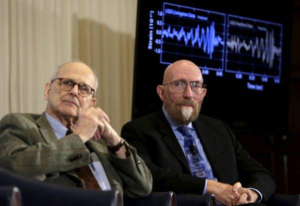 FILE PHOTO: Dr. Rainer Weiss, emeritus professor of physics at MIT, (L) and Dr. Kip Thorne of Caltech (R) listen during a news conference to discuss the detection of gravitational waves, ripples in space and time hypothesized by physicist Albert Einstein a century ago, in Washington February 11, 2016. REUTERS/Gary Cameron/File Photo