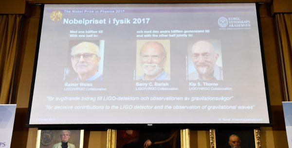 Nobel Committee for Physics members (Bottom L-R) chairman, Professor Nils Martensson, Goran K Hansson, Secretary General of the Royal Swedish Academy of Sciences and Olga Botner, Professor of Experimental Elementary Particle Physics, announce the 2017 Nobel Prize winners in Physics on October 3, 2017, at the Royal Swedish Academy of Sciences in Stockholm. (On the display) 2017 laureates for the Nobel Prize in Physics are: Rainer Weiss, Barry C. Barish and Kip S. Thorne. (Jonathan Nackstrand/AFP/Getty Images)