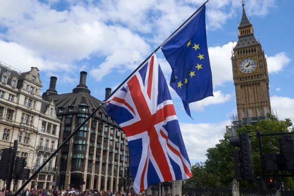 An EU and a Union Flag are seen in front of Elizabeth Tower (Big Ben) during a pro-EU rally in Parliament Square, Sept. 9, 2017. (Niklas Halle'n/AFP/Getty Images)