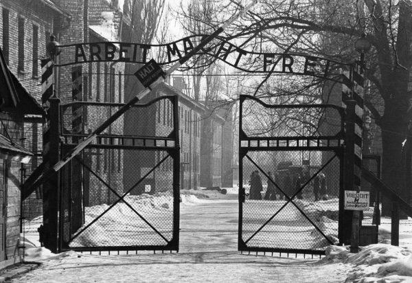 The gates of the Nazi concentration camp at Auschwitz, Poland, circa 1965. The sign above them is "Arbeit Macht Frei," or "Work Makes You Free." (Keystone/GettyImages)