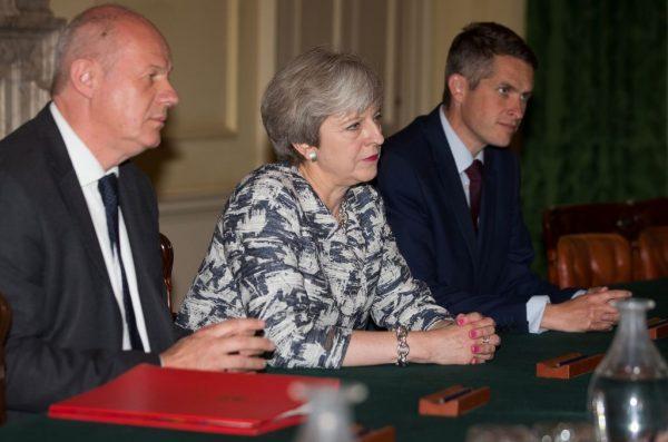 Britain's Conservative party leader and Prime Minister Theresa May (2L) sits with Britain's First Secretary of State Damian Green (L), and Britain's Parliamentary Secretary to the Treasury and Chief Whip, Gavin Williamson, June 26 2017. May and Green are said to be close allies. (Daniel Leal-Olivas/AFP/Getty Images)