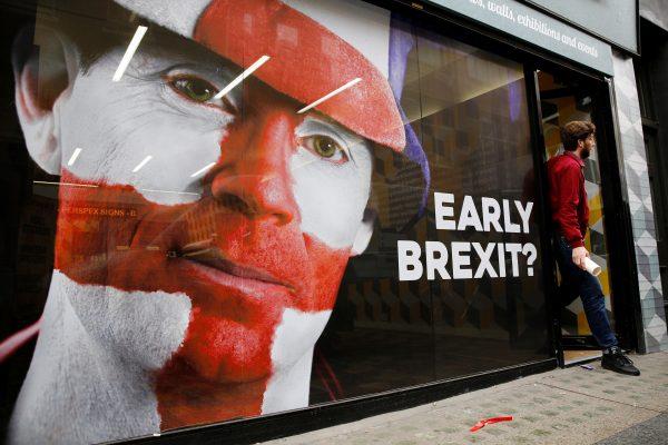 A man leaves a shop in London, Britain, June 13, 2016. (Reuters/Stefan Wermuth/File Photo)