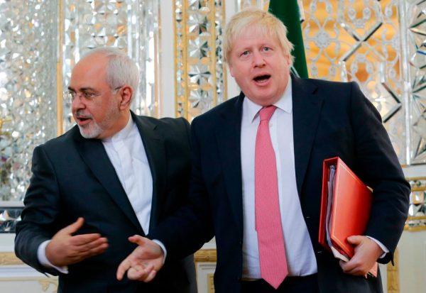 Iran's Foreign Minister Mohammad Javad Zarif (L) shakes hands with his British counterpart Boris Johnson during a meeting in Tehran on December 9, 2017.<br/>(Atta Kenare/AFP/Getty Images)