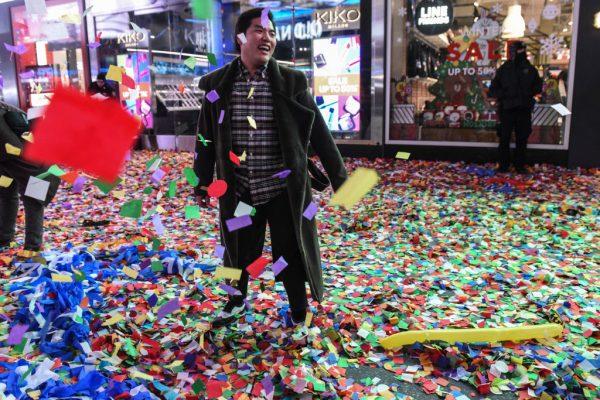 People throw confetti on New Year's Eve in Times Square on January 1, 2018 in New York City. (Stephanie Keith/Getty Images)