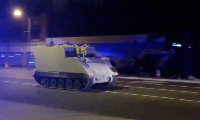 An armored personnel carrier (APC), which was purpotedly stolen, drives along a street in Richmond, Virginia, U.S. June 5, 2018, in this still image taken from a video obtained from social media. (Parker Slaybaugh/Reuters)