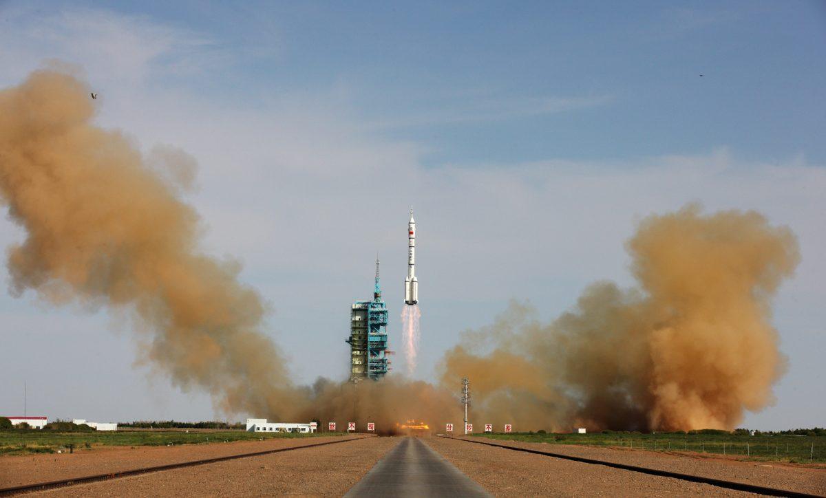The Long March-2F rocket, carrying China's manned Shenzhou-10 spacecraft, blasts off from its launch pad at Jiuquan Satellite Launch Center in Jiuquan, Gansu Province, China, on June 11, 2013. The Chinese regime has been quietly building up its anti-satellite weapons as it continues its push into space using manned space flights. (ChinaFotoPress/Getty Images)