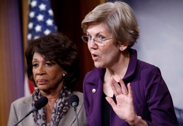 In this file photo, Sen. Elizabeth Warren (R) (D-Mass.) Rep. Maxine Waters (D-Calif.) express their outrage that a huge, $1.1 trillion spending bill approved by the then Republican-controlled House contained changes to the 2010 Dodd-Frank law, on Dec. 10, 2014, on Capitol Hill in Washington. (J. Scott Applewhite/AP Photo)