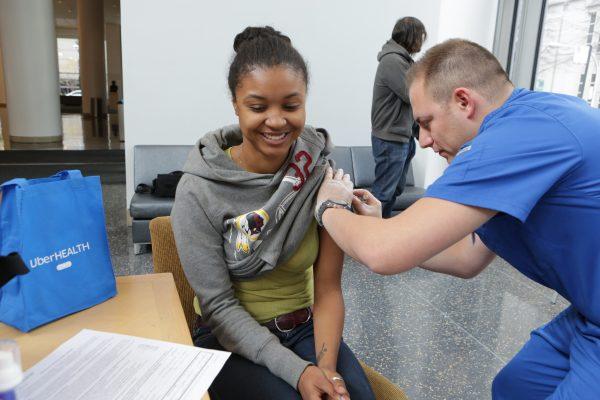 A student gets a flu vaccination in Chicago on Nov. 18, 2014. (Jean-Marc Giboux/AP Images for Uber)