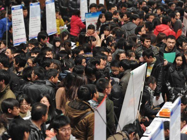Thousands of job seekers flock to an employment fair in Hefei, Anhui Province, China, on Feb. 25, 2015. (STR/AFP/Getty Images)