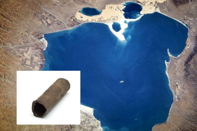 A file photo of a pipe, and a view of Qinghai Lake in China, near which mysterious iron pipes were found. (NASA; Pipe image via Zhax/Shutterstock)