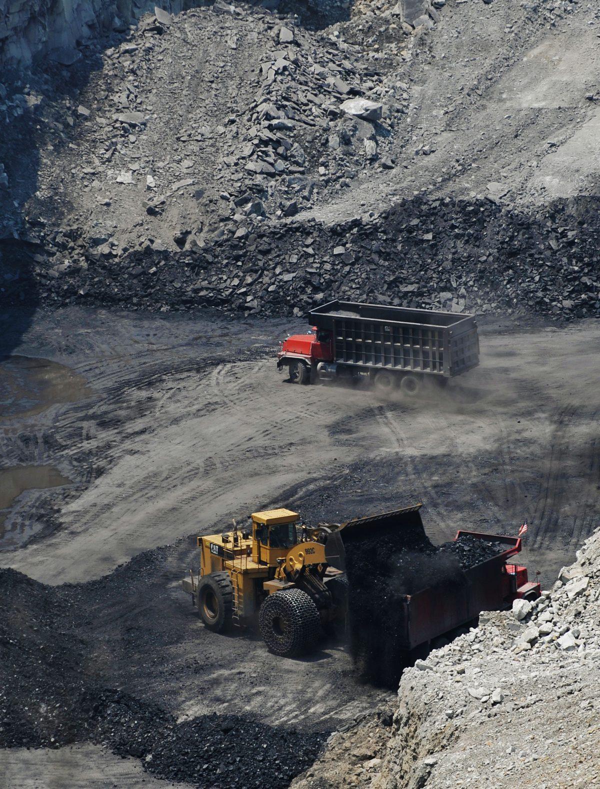 Coal is being loaded onto a truck at a coal mine on top of Kayford Mountain in West Virginia, on June 12, 2008.  (Mandel Ngan/AFP/Getty Images)