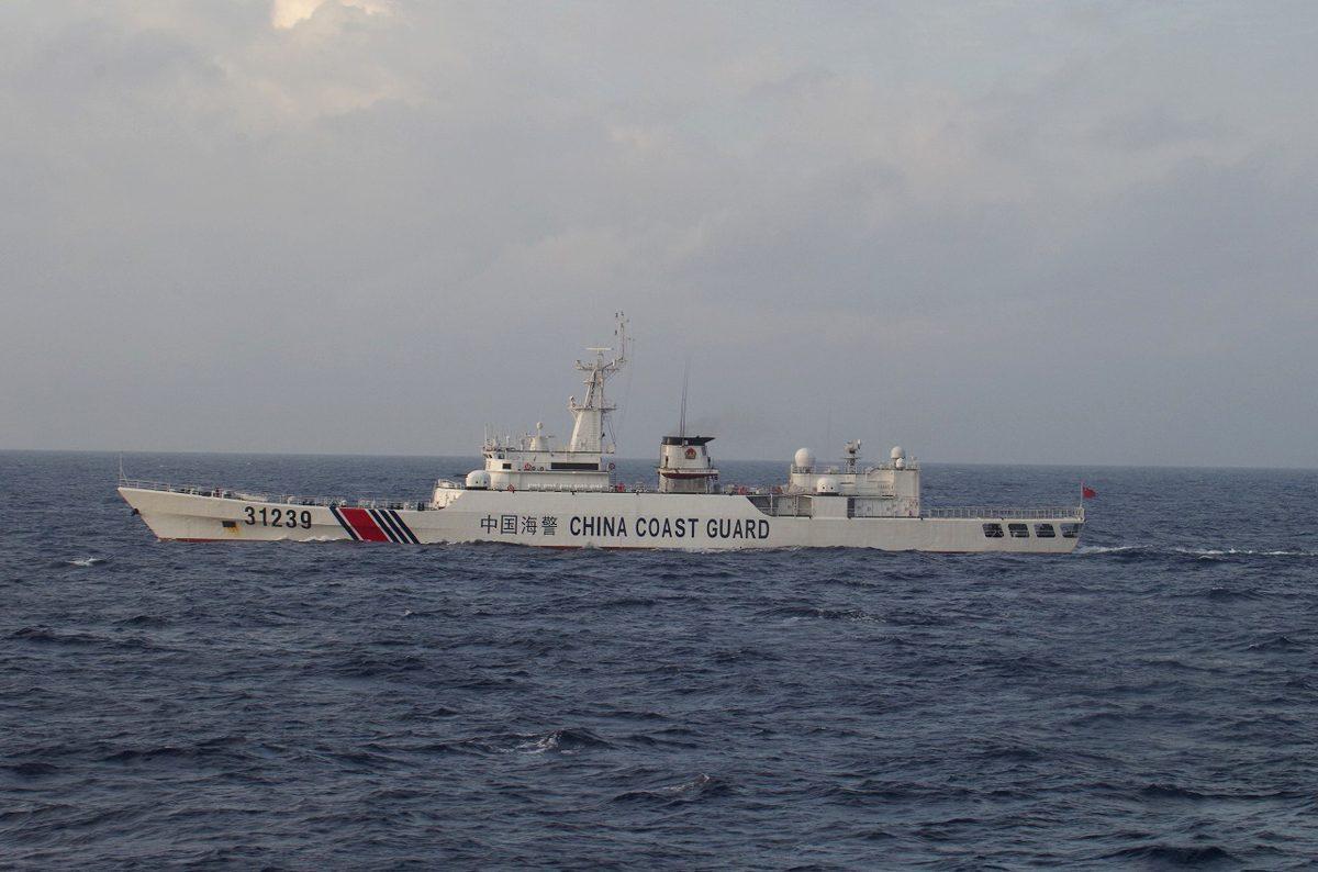 An armed Chinese coast guard ship sails in the water near islands, known as the Senkaku in Japanese and the Diaoyu in Chinese, on Dec. 22, 2015. (Japan Coast Guard via AP)