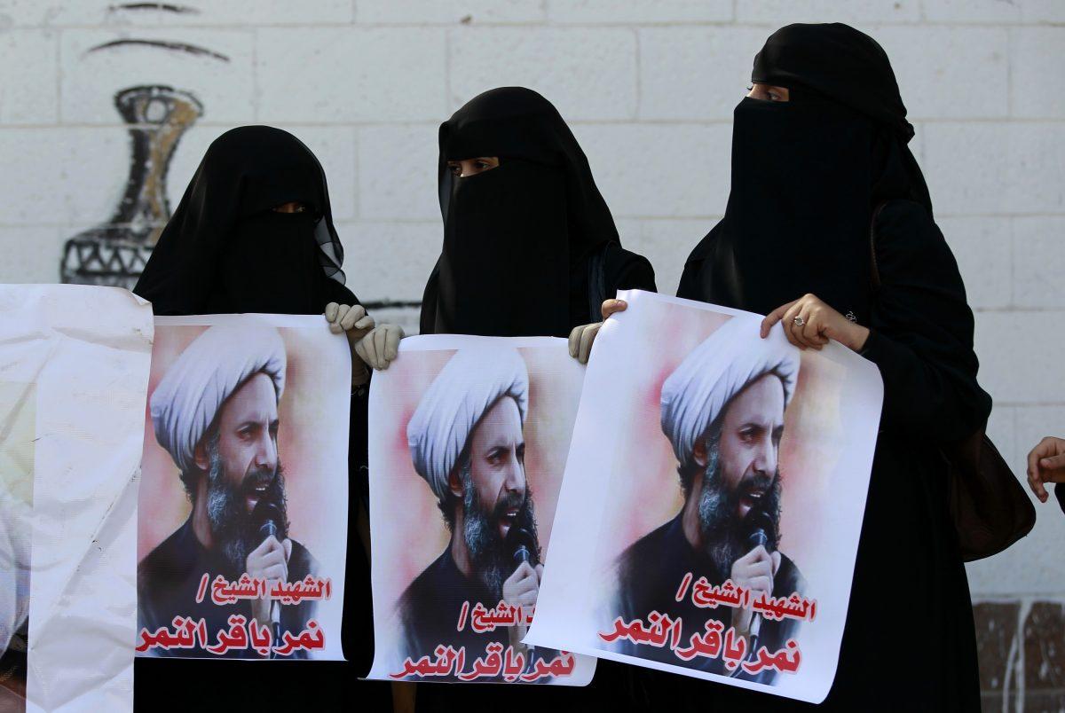Yemeni women, supporters of Iran-backed Shiite Houthi rebels, hold posters bearing portraits of Shiite cleric Nimr al-Nimr, who was executed by Saudi authorities on Jan. 2, 2016, during a demonstration outside of the Saudi Embassy in Yemen's capital, Sanaa, on Jan. 7, 2016. (Mohammed Huwais/AFP/Getty Images)