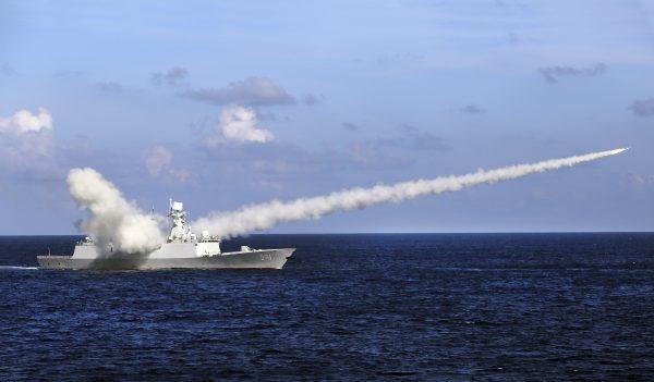 Chinese missile frigate Yuncheng launches an anti-ship missile during a military exercise in the waters near south China's Hainan Island and Paracel Islands on July 8, 2016. (Zha Chunming/Xinhua via AP)