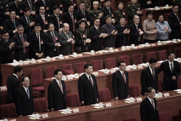 (L-R) Politburo Standing Committee member Wang Qishan, National People's Congress chairman Zhang Dejiang, Chinese leader Xi Jinping, Premier Li Keqiang, Politburo Standing Committee member Liu Yunshan and Politburo member Zhang Gaoli at the Great Hall of the People in Beijing on March 3, 2017. (Greg Baker/AFP/Getty Images)