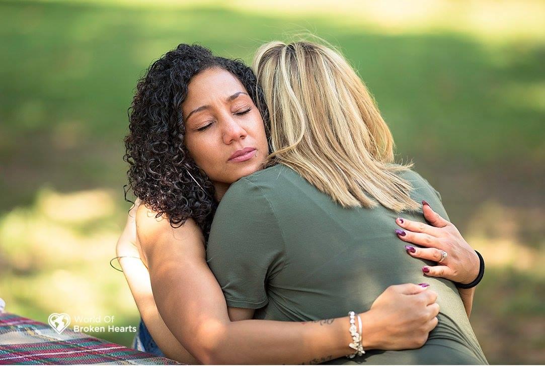 Lacey Tiara Wilcox (L) hugs Angela Perkins in Centennial Park in Nashville, Tenn., on Sept. 25, 2017. (Suha Dabit/World of Broken Hearts)