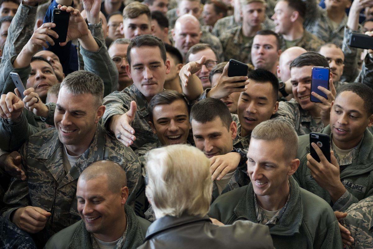 President Donald Trump greets US troops after speaking during an event at Yokota Air Base in Tokyo on November 5, 2017. (JIM WATSON/AFP/Getty Images)