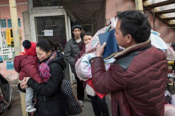 Residents leaving their homes after receiving eviction notices, on the outskirts of Beijing on November 27, 2017. (Fred Dufour/AFP/Getty Images)