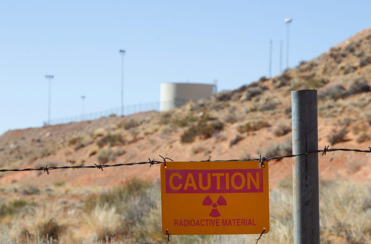 A radioactive warning sign hangs on fencing around the Anfield's Shootaring Canyon Uranium Mill outside Ticaboo, Utah, on Oct. 27, 2017. (George Frey/Getty Images)