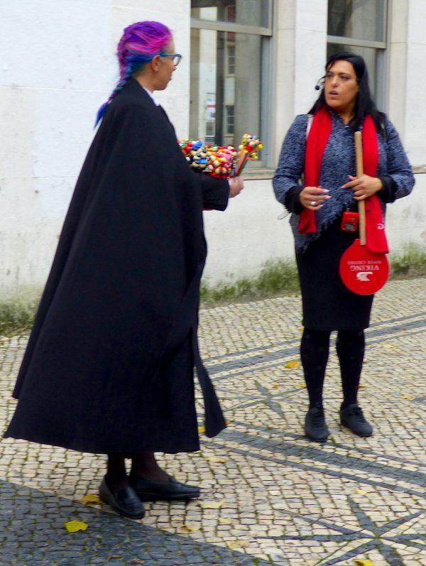 Coimbra University student wearing a black cape. (Manos Angelakis)