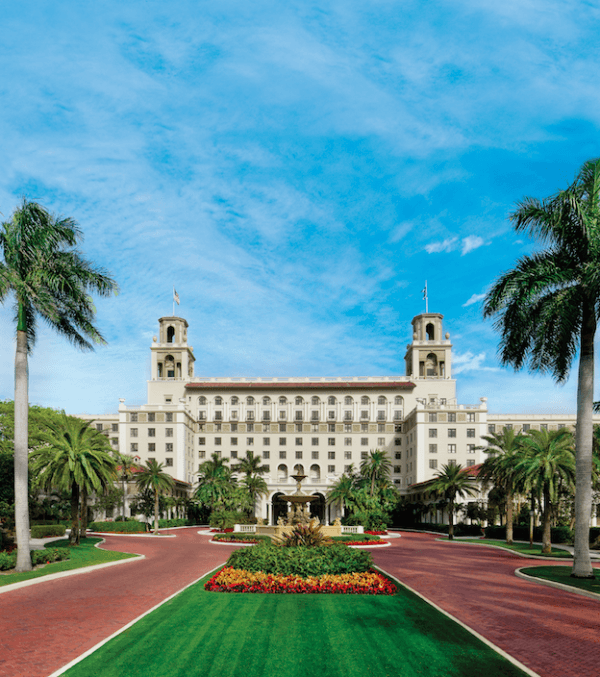 The front drive leading to The Breakers; the twin towers are patterned after Rome’s Villa Medici. (COURTESY OF THE BREAKERS PALM BEACH)