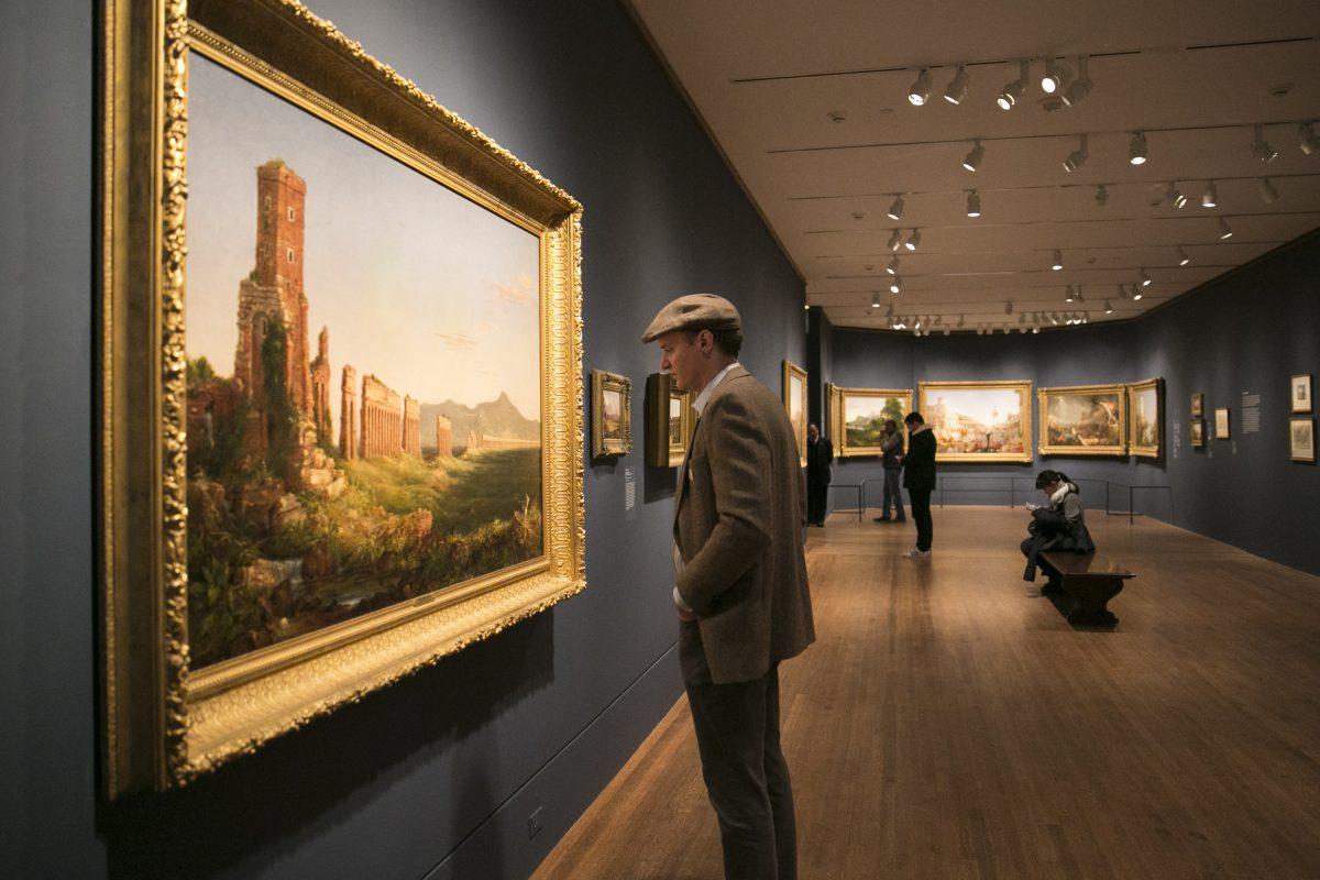 Landscape painter Erik Koeppel looks at a Thomas Cole painting at The Metropolitan Museum of Art in Manhattan, New York, on Feb. 26, 2018. (Milene Fernandez/The Epoch Times)