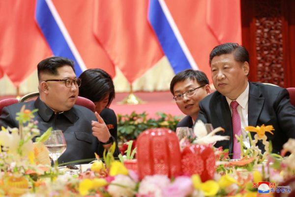 North Korean leader Kim Jong Un meets with Chinese leader Xi Jinping, in Dalian City in northeastern China in this undated photo released on May 9, 2018. (KCNA/via Reuters)