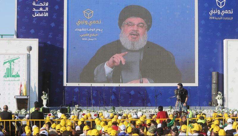 Hezbollah leader Sayyed Hassan Nasrallah addresses crowd on television on April 15, 2018. (Aziz Taher/Reuters)