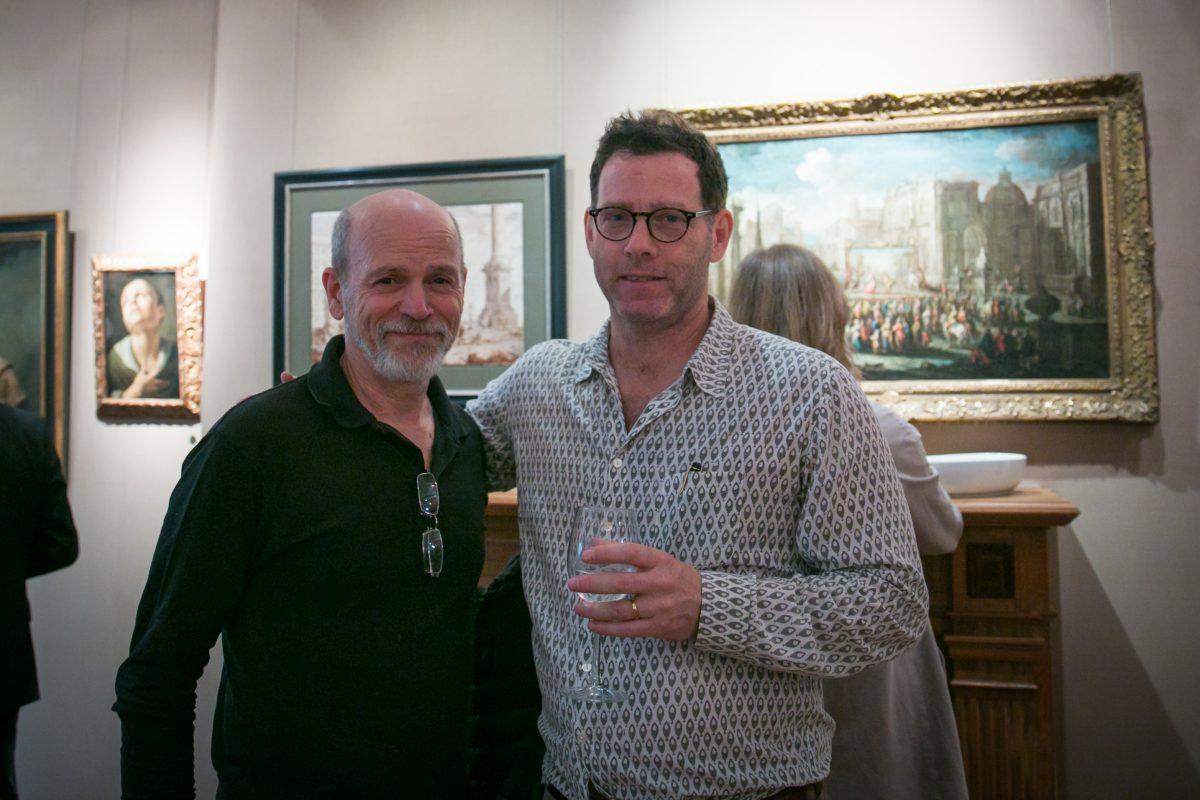 Jacob Collins (R), artist and founder of Grand Central Atelier, poses for a photograph with Daniel Graves, artist and founder of The Florence Academy of Art, at the opening of "The Unbroken Line: Old and New Masters" in the Robert Simon Fine Art Gallery on May 10, 2018. (Milene Fernandez/The Epoch Times)