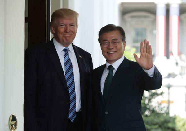 U.S. President Donald Trump welcomes South Korean President Moon Jae-in during his arrival outside the West Wing of the White House in Washington on June 30, 2017. (Alex Wong/Getty Images)