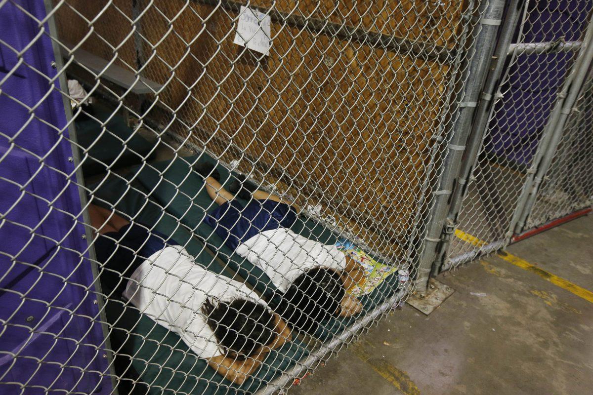 Prominent liberals shared this 2014 photo of two female detainees sleep in a holding cell in the U.S. Customs and Border Protection Nogales Placement Center on June 18, 2014, in Nogales, Arizona. (Ross D. Franklin-Pool/Getty Images)