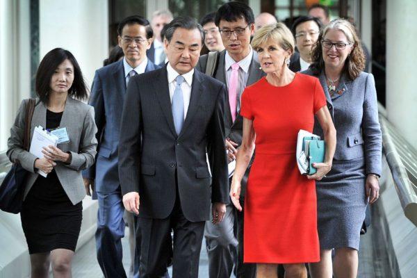 Australia's former Foreign Minister Julie Bishop (front R) walks with her then-Chinese counterpart Wang Yi (front L) at Parliament House in Canberra on Feb. 7, 2017. (Mark Graham/AFP/Getty Images)