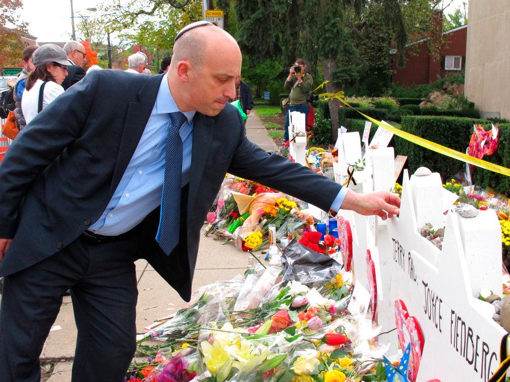Jonathan Greenblatt, CEO and national director of the Anti-Defamation League, places a stone on the Star of David for Dr. Jerry Rabinowitz at Tree of Life synagogue in Pittsburgh on Oct. 31, 2018. (Allen G. Breed/AP Photo)