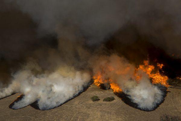 Flames overtake the Reagan Ranch, once owned by President Ronald Reagan, at Malibu Creek State Park during the Woolsey Fire near Malibu, Calif. on Nov. 9, 2018. (Photo by David McNew/Getty Images)