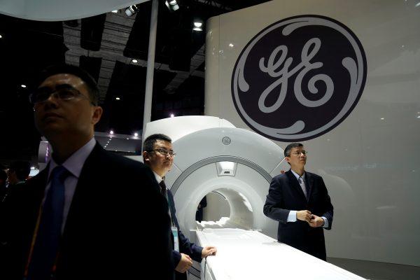 A General Electric sign during the China International Import Expo in Shanghai, China, on Nov. 6, 2018. Federal prosecutors in April 2019 charged two Chinese nationals with stealing information related to GE’s turbine technology for the benefit of the Chinese regime. (Aly Song/Reuters)