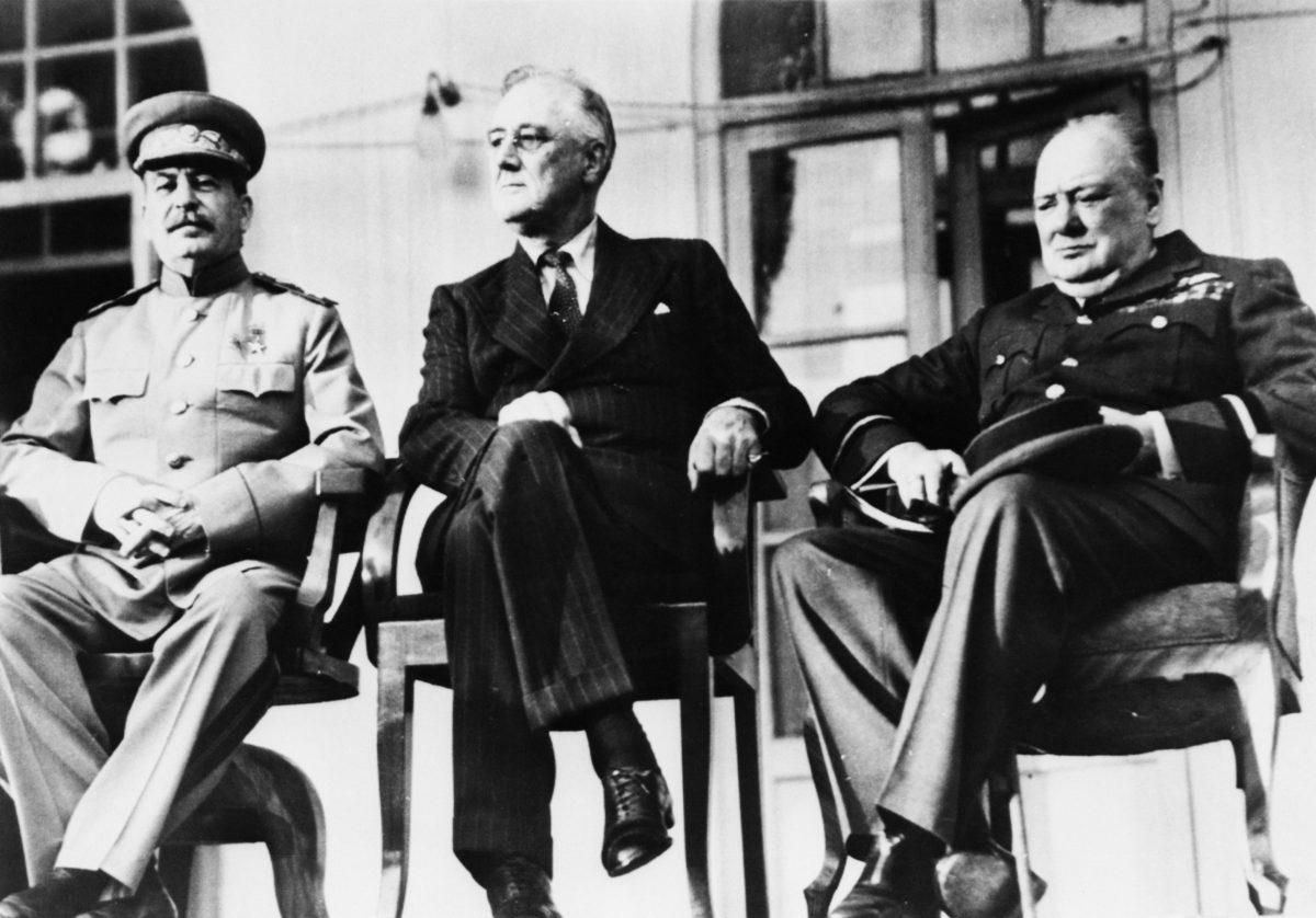 The historic meeting of the 'Big Three' in Tehran, Iran, in December 1943. Left to right: Soviet dictator Marshal Joseph Stalin (1879–1953), U.S President Franklin D. Roosevelt (1882–1945), and British Prime Minister Winston Churchill (1874–1965). They met in person for the first time to discuss the coordination of Allied war efforts and the post-war aims of their respective countries. (Keystone/Hulton Archive/Getty Images)